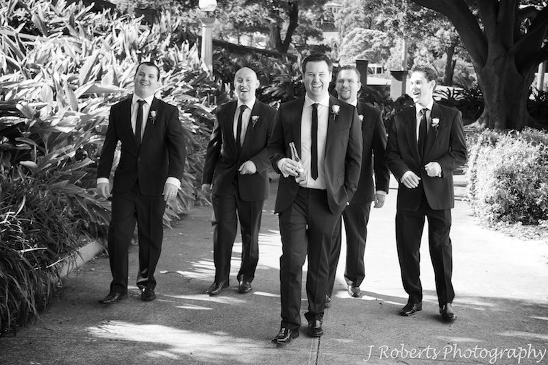 Groom and his groomsman doing the reservoir dogs walk - wedding photography sydney